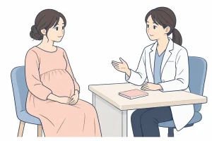 妊娠中の体調について医師に相談する女性